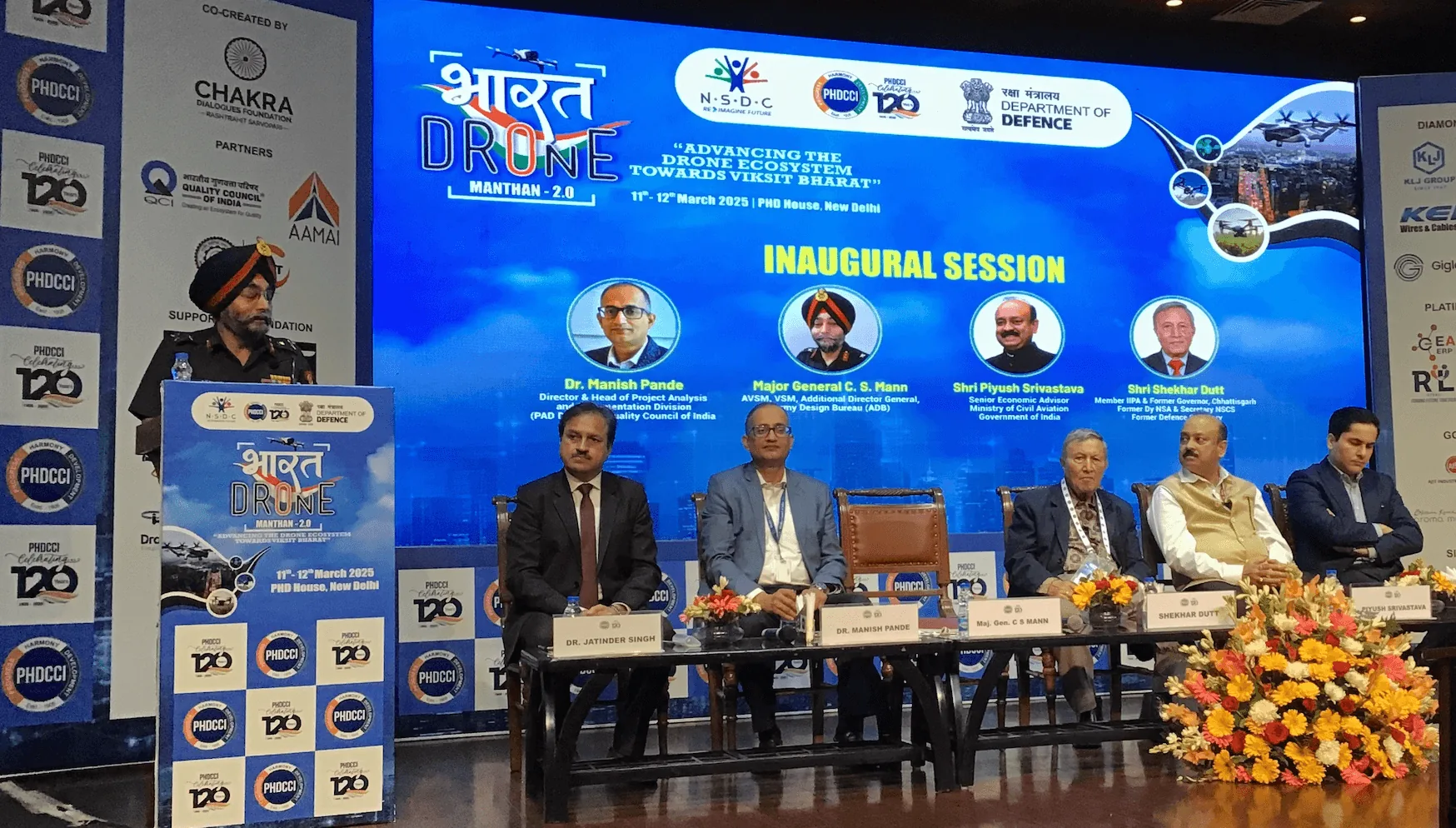 Inaugural session panel on stage at Bharat Drone Manthan 2.0, PHD House New Delhi, March 2025, with Dr Manish Pande, Major General C S Mann, Shri Piyush Srivastava and Shri Shekhar Dutt